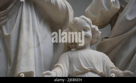 Sculpture of Joseph, Mary and Jesus statues in a niche wall at St. Joseph`s Church, in the old city of Nazareth in Israel Stock Photo